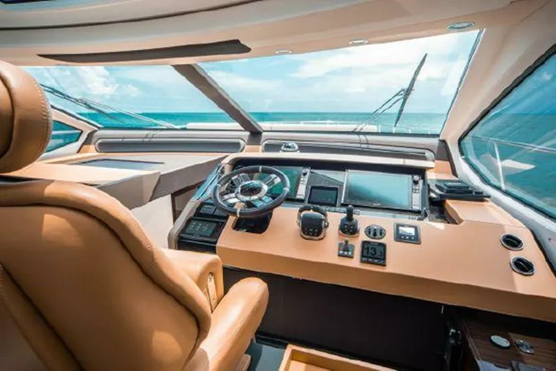 Slide: The Image of Luxurious helm of a 2019 Azimut 77S yacht with advanced navigation controls. - 8