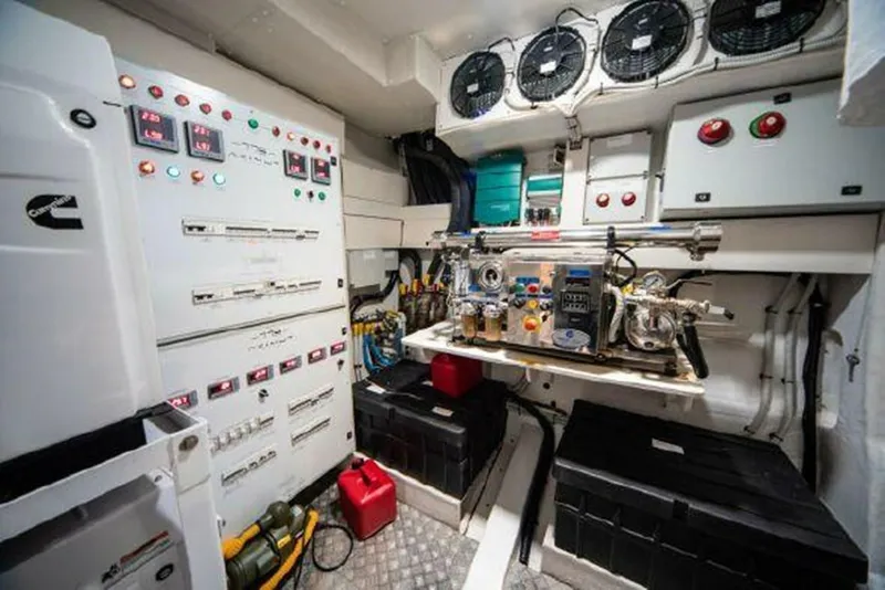 Slide: The Image of Engine room of a 2019 Azimut 77S yacht with control panels and machinery. - 36