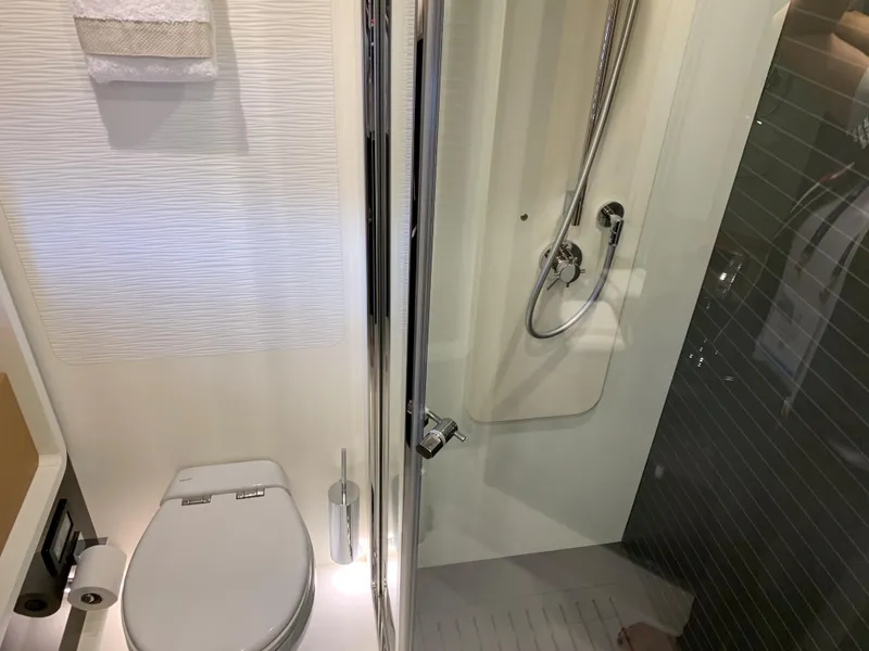 Slide: The Image of Modern bathroom on a 2019 Azimut 77S yacht with shower and toilet. - 27