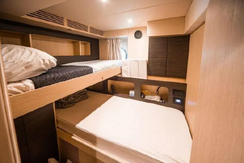 Slide: The Image of 2019 Azimut 77S yacht interior cabin with bunk beds and modern design. - 29