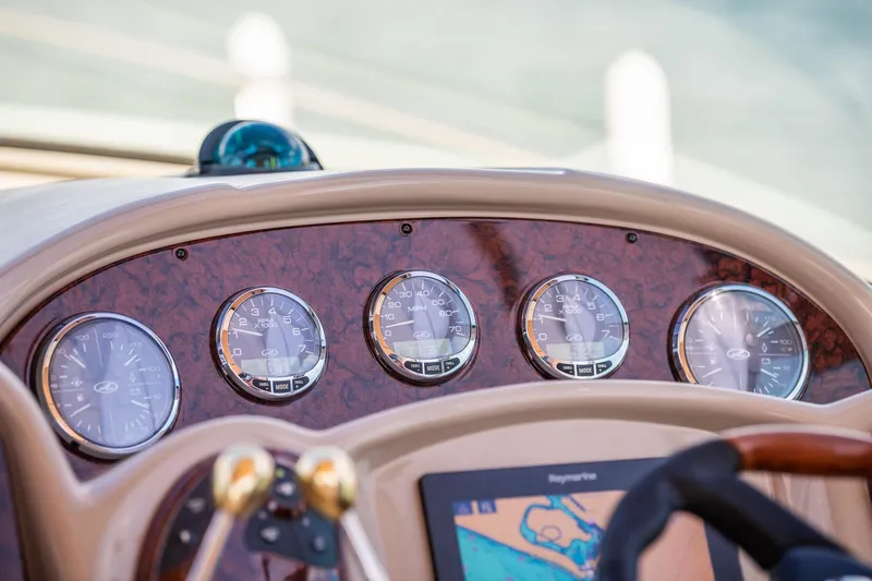 Slide: The Image of Dashboard of 2003 Sea Ray 340 Sundancer with gauges and navigation display. - 15