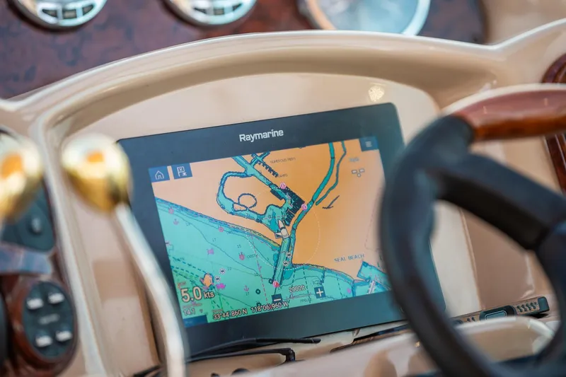 Slide: The Image of Raymarine navigation display on 2003 Sea Ray 340 Sundancer boat dashboard. - 16