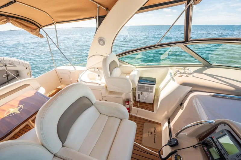 Slide: The Image of Luxurious 2003 Sea Ray 340 Sundancer yacht interior with ocean view and elegant seating. - 20
