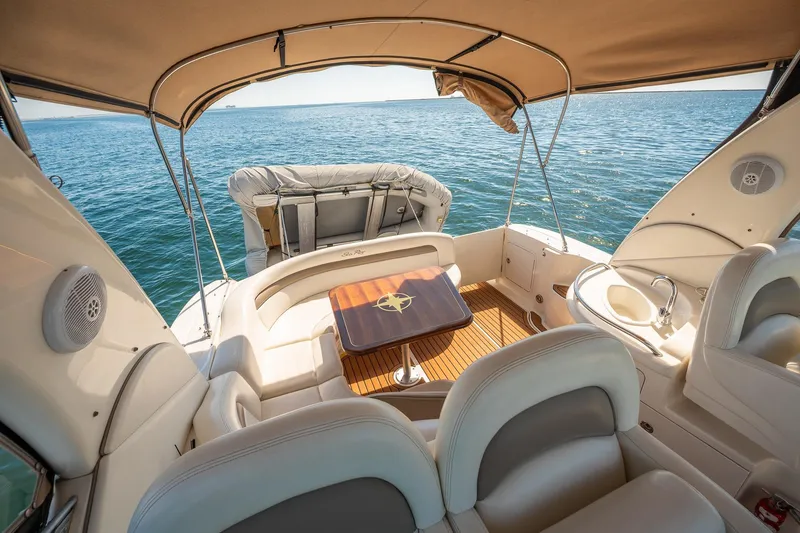 Slide: The Image of 2003 Sea Ray 340 Sundancer yacht interior with seating and ocean view. - 21