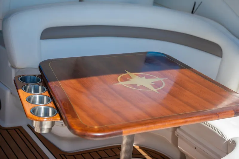 Slide: The Image of Luxurious wooden table with cup holders on 2003 Sea Ray 340 Sundancer yacht. - 24