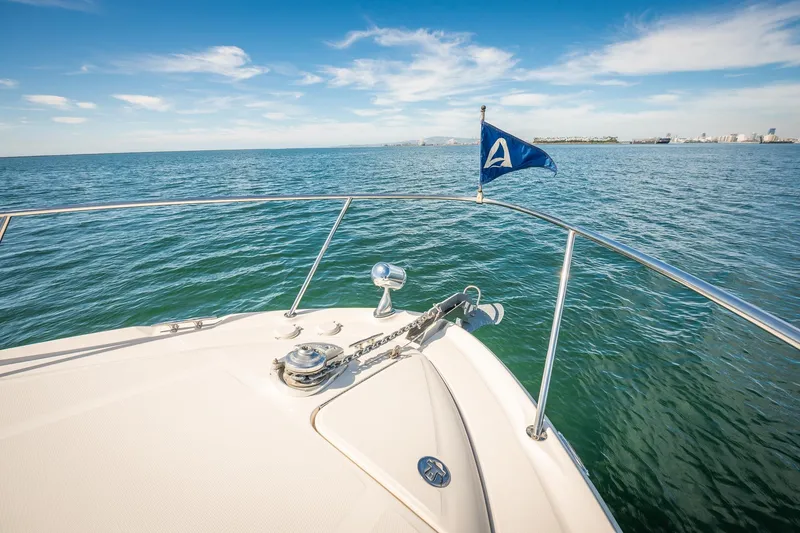 Slide: The Image of Bow view of 2003 Sea Ray 340 Sundancer yacht on open water. - 27