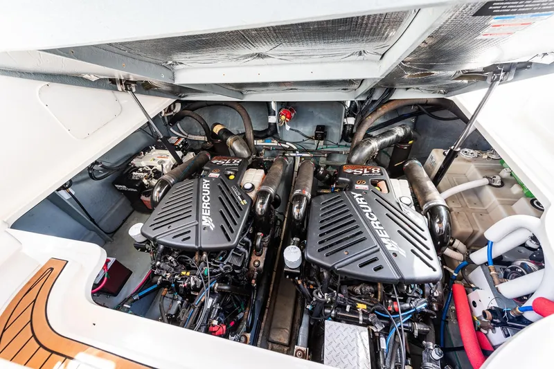 Slide: The Image of Engine compartment of 2003 Sea Ray 340 Sundancer with twin Mercury engines. - 37