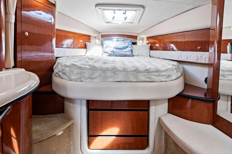 Slide: The Image of Luxurious cabin interior of 2003 Sea Ray 340 Sundancer yacht with elegant wood finish. - 4