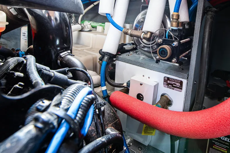 Slide: The Image of Engine room of 2003 Sea Ray 340 Sundancer with visible water heater and wiring. - 40