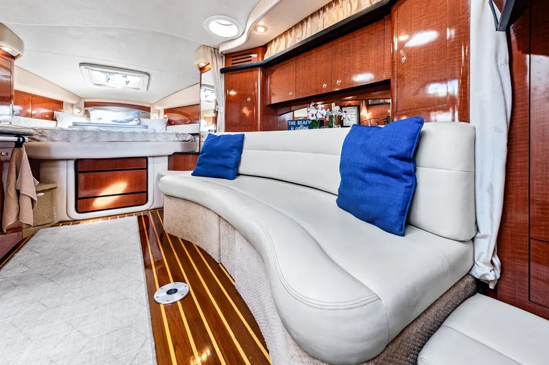 Slide: The Image of Luxurious interior of 2003 Sea Ray 340 Sundancer yacht with plush seating and elegant wood finishes. - 5