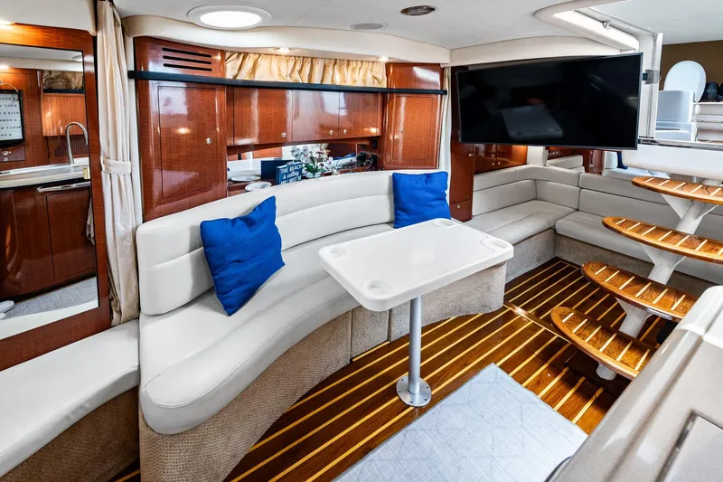 Slide: The Image of Luxurious interior of 2003 Sea Ray 340 Sundancer yacht with elegant seating and modern amenities. - 9