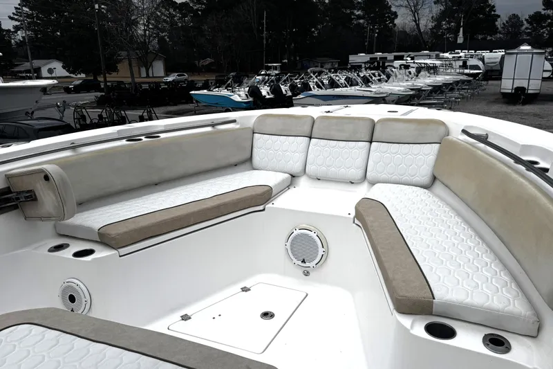 Slide: The Image of 2021 Sea Fox 328 Commander boat interior with open storage drawers and cushioned seating. - 13