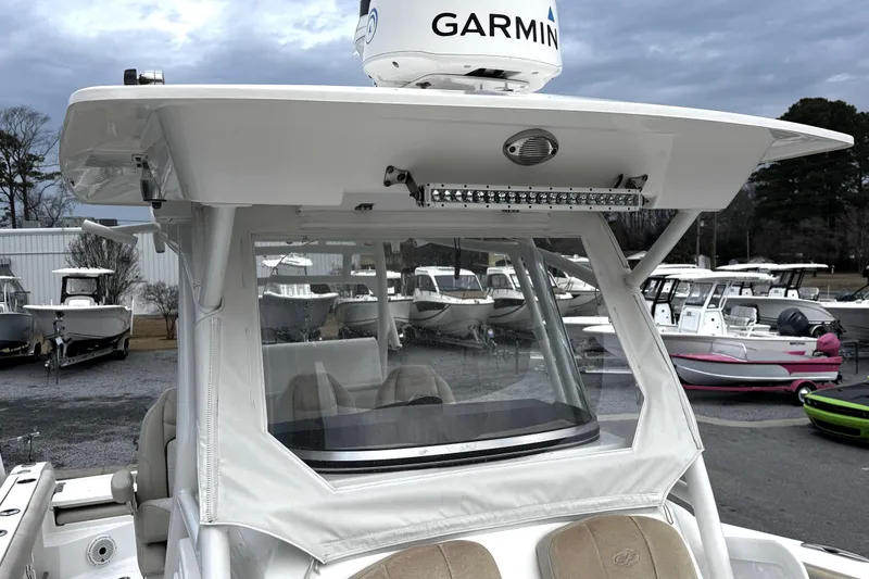 Slide: The Image of 2021 Sea Fox 328 Commander boat interior with open storage compartments and seating. - 22