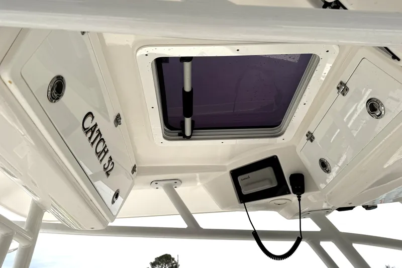 Slide: The Image of 2021 Sea Fox 328 Commander boat interior with cushioned seating and modern design. - 24