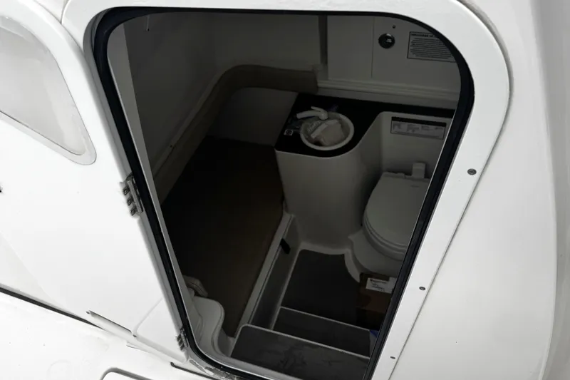 Slide: The Image of 2021 Sea Fox 328 Commander boat storage compartment open, showcasing spacious interior. - 25