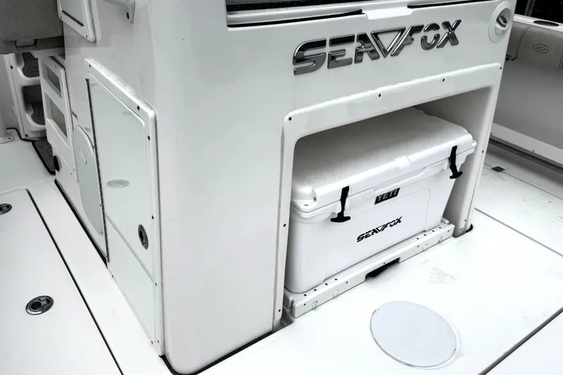 Slide: The Image of Control panel of a 2021 Sea Fox 328 Commander boat, featuring circuit breakers and switches. - 34