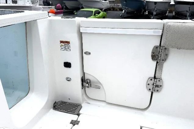 Slide: The Image of 2021 Sea Fox 328 Commander boat seating area with white and beige upholstery. - 41