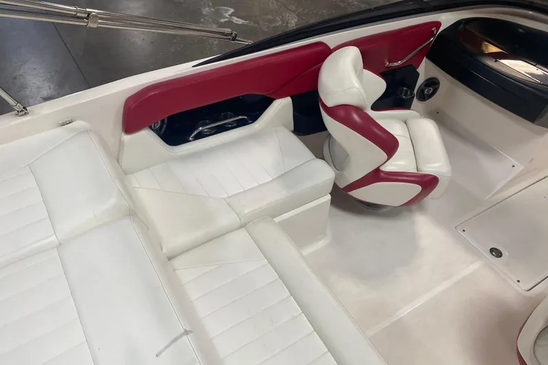 Slide: The Image of 2008 Regal 2000 Bowrider interior with white and red seating, showcasing sleek design. - 10