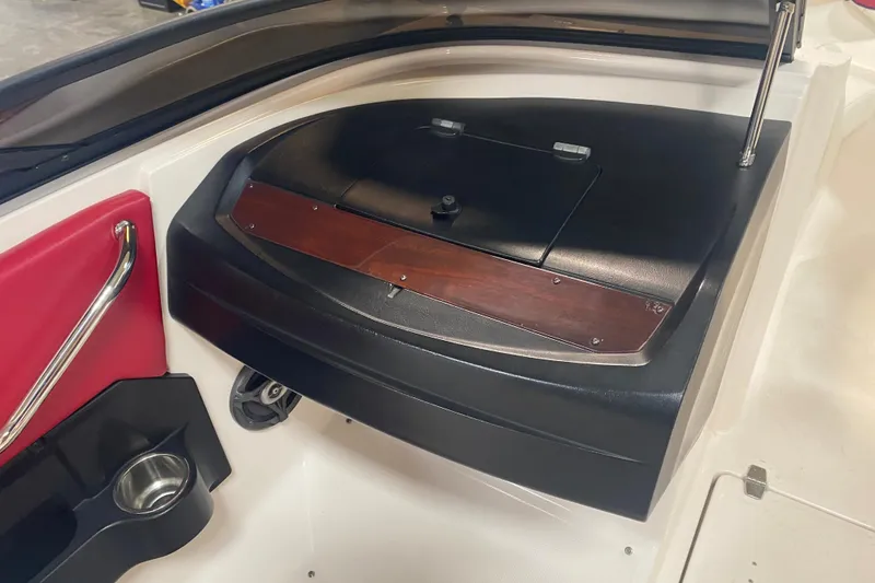 Slide: The Image of 2008 Regal 2000 Bowrider interior with red accents and storage compartment. - 16