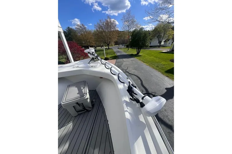Slide: The Image of 2021 Parker 2300 DV Center Console boat with trolling motor on deck. - 4