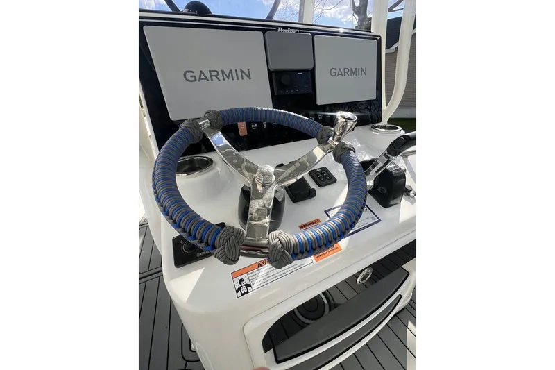 Slide: The Image of 2021 Parker 2300 DV Center Console with Garmin displays and wrapped steering wheel. - 5