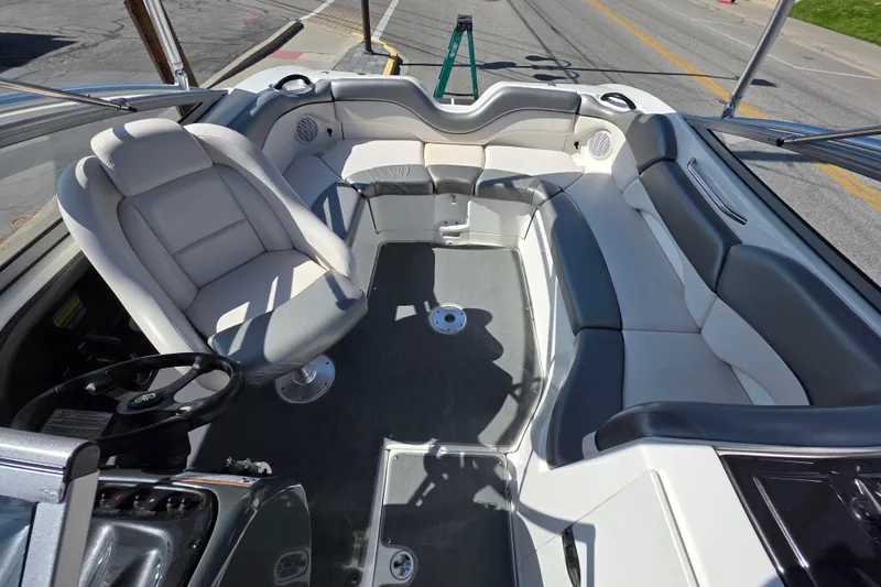 Slide: The Image of 2009 Yamaha Boats AR210 interior with spacious seating and modern design. - 10