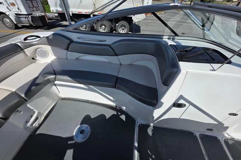 Slide: The Image of 2009 Yamaha Boats AR210 interior with gray seating and sleek design. - 12