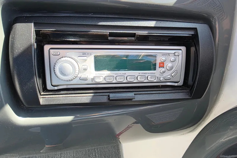 Slide: The Image of 2009 Yamaha AR210 boat stereo system with CD player and radio controls. - 16