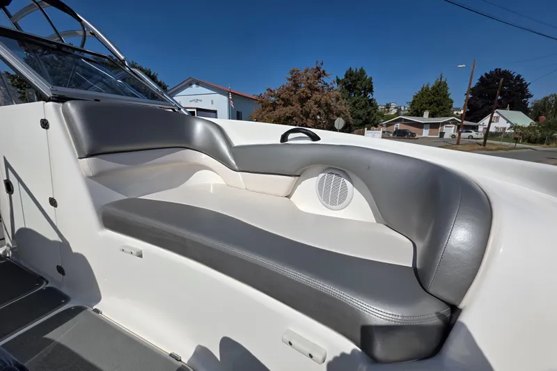 Slide: The Image of 2009 Yamaha AR210 boat interior with gray seating and speaker. - 21