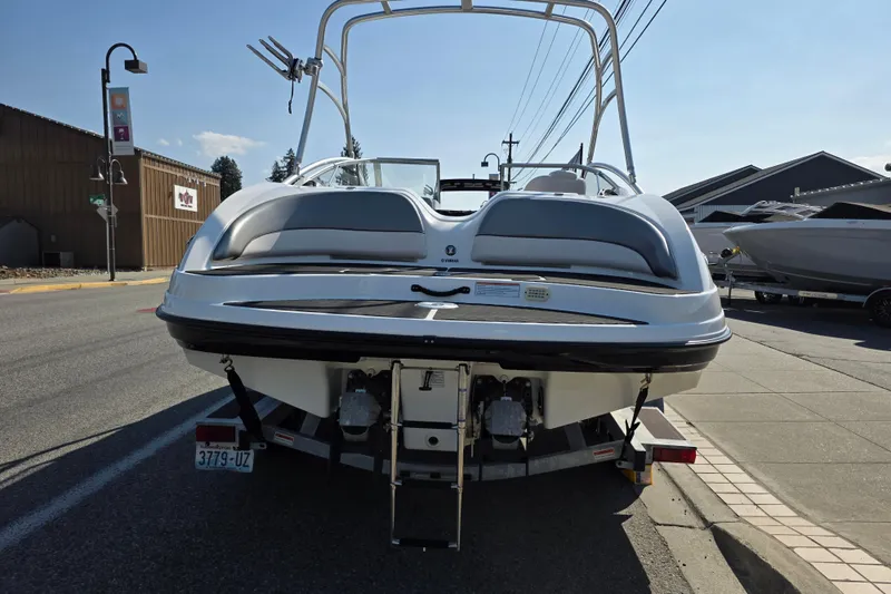 Slide: The Image of 2009 Yamaha Boats AR210 on trailer, parked on street, rear view. - 7
