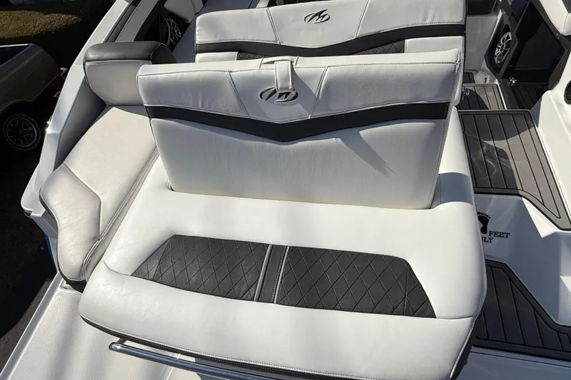 Slide: The Image of 2018 Monterey 278 SSC boat interior with white and black seating. - 11