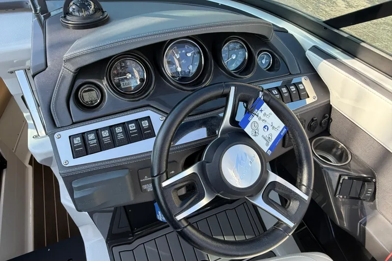 Slide: The Image of 2018 Monterey 278 SSC boat dashboard with steering wheel and instrument panel. - 15