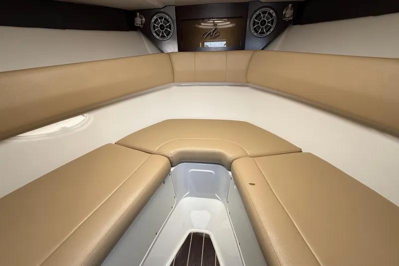 Slide: The Image of Interior of 2018 Monterey 278 SSC boat with tan seating and speakers. - 17