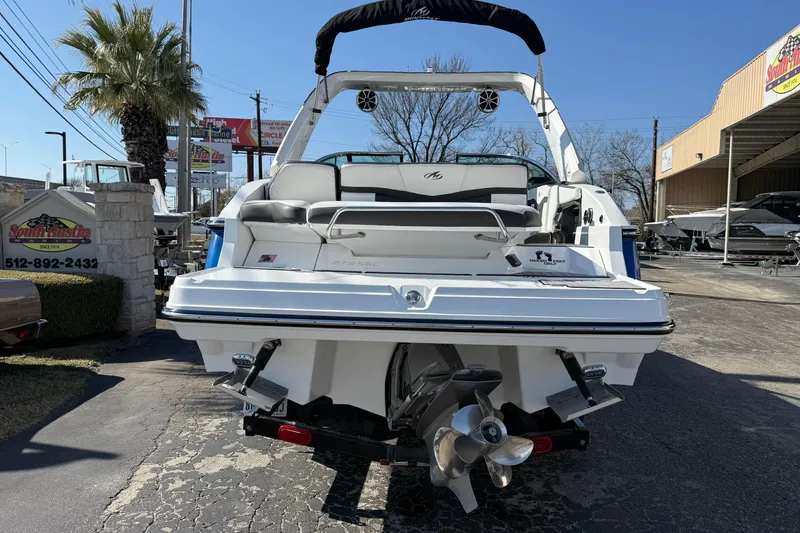 Slide: The Image of 2018 Monterey 278 SSC boat displayed outdoors at a dealership. - 5