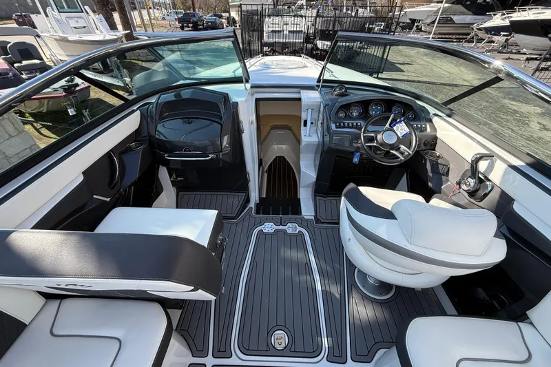 Slide: The Image of 2018 Monterey 278 SSC boat interior with modern dashboard and seating. - 7
