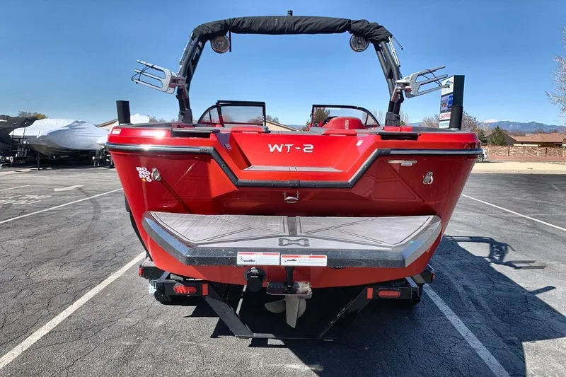 Slide: The Image of Red 2023 Heyday WT-2DC boat rear view in a parking lot. - 14