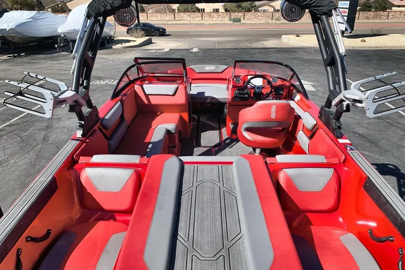 Slide: The Image of 2023 Heyday WT-2DC boat interior with red and gray seating, modern dashboard. - 19