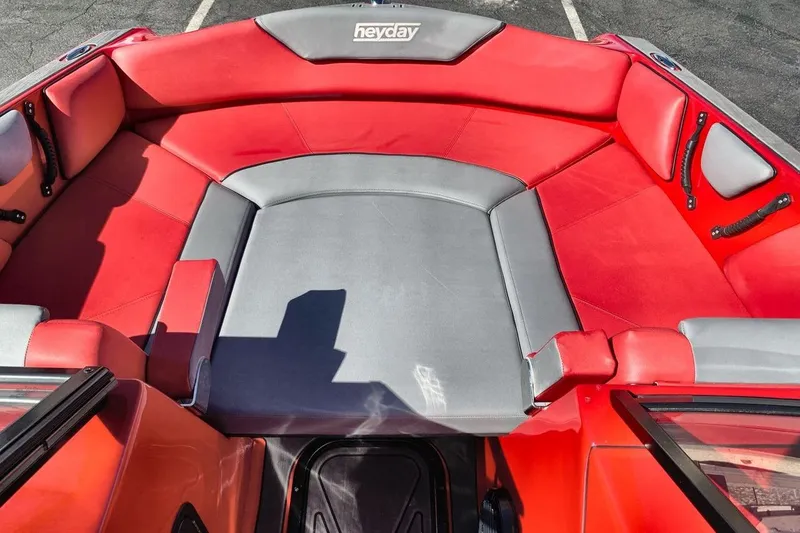 Slide: The Image of 2023 Heyday WT-2DC boat interior with red and gray seating. - 21