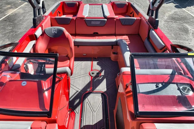 Slide: The Image of 2023 Heyday WT-2DC boat interior with red and gray seating, open layout. - 22