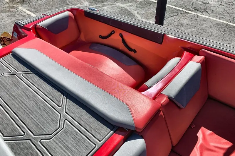 Slide: The Image of Red and gray interior of 2023 Heyday WT-2DC boat, featuring cushioned seating. - 29