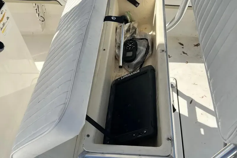 Slide: The Image of Storage compartment of 2010 Key West 246 Bay Reef boat with electronics and accessories. - 21