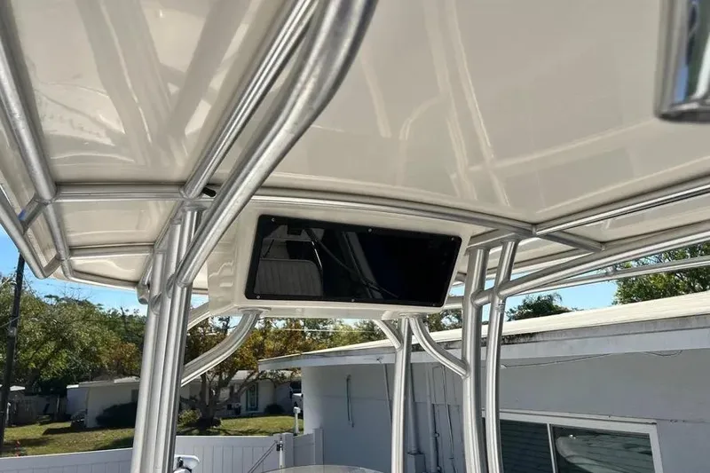 Slide: The Image of 2010 Key West 246 Bay Reef boat T-top with sturdy metal frame. - 22