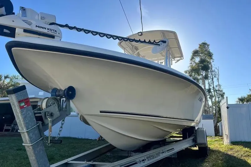 Slide: The Image of 2010 Key West 246 Bay Reef boat on trailer, featuring Minn Kota Ulterra motor. - 5