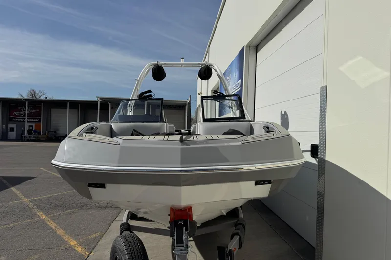 Slide: The Image of 2026 Moomba Max boat on trailer outside a service center. - 4