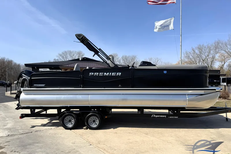 The Image of 2026 Premier 230 Sunsation Angler 2pt pontoon boat on trailer, outdoor setting. - 0