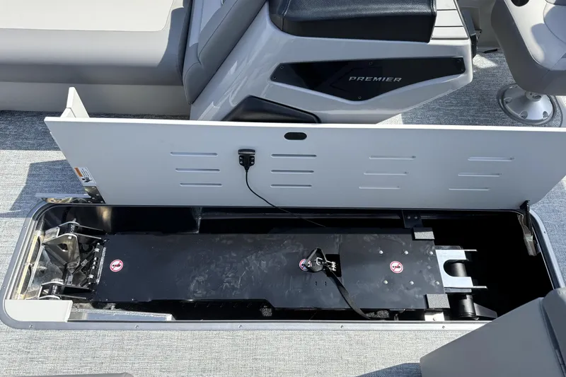Slide: The Image of Open storage compartment in 2026 Premier 230 Sunsation Angler 2pt boat interior. - 15