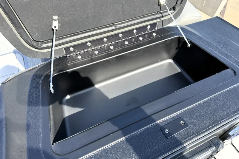 Slide: The Image of Open storage compartment on 2026 Premier 230 Sunsation Angler 2pt boat. - 19