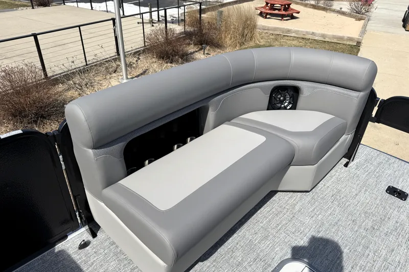 Slide: The Image of Premier 230 Sunsation Angler 2pt 2026 boat interior with gray seating and speaker. - 21