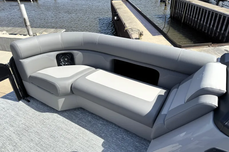 Slide: The Image of Premier 230 Sunsation Angler 2pt 2026 boat interior with gray seating by the dock. - 22