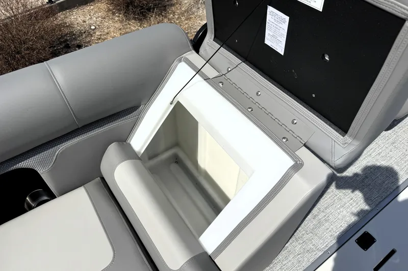 Slide: The Image of Open storage compartment on 2026 Premier 230 Sunsation Angler 2pt boat. - 26